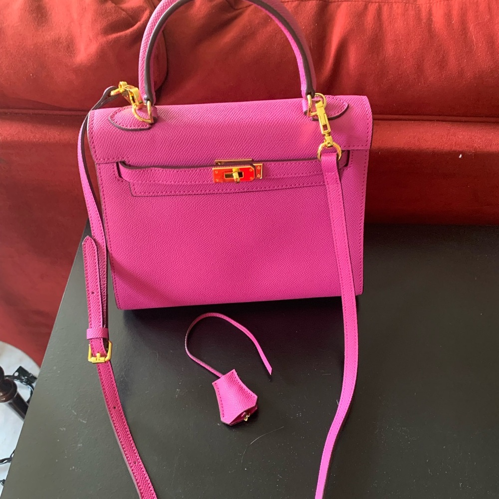Elegant Pink Real Leather Bag.. with a beautiful Gold lock key and chochette